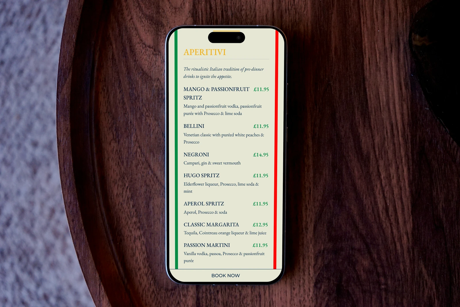 Bella Capri website displayed on a phone in a photographed setting