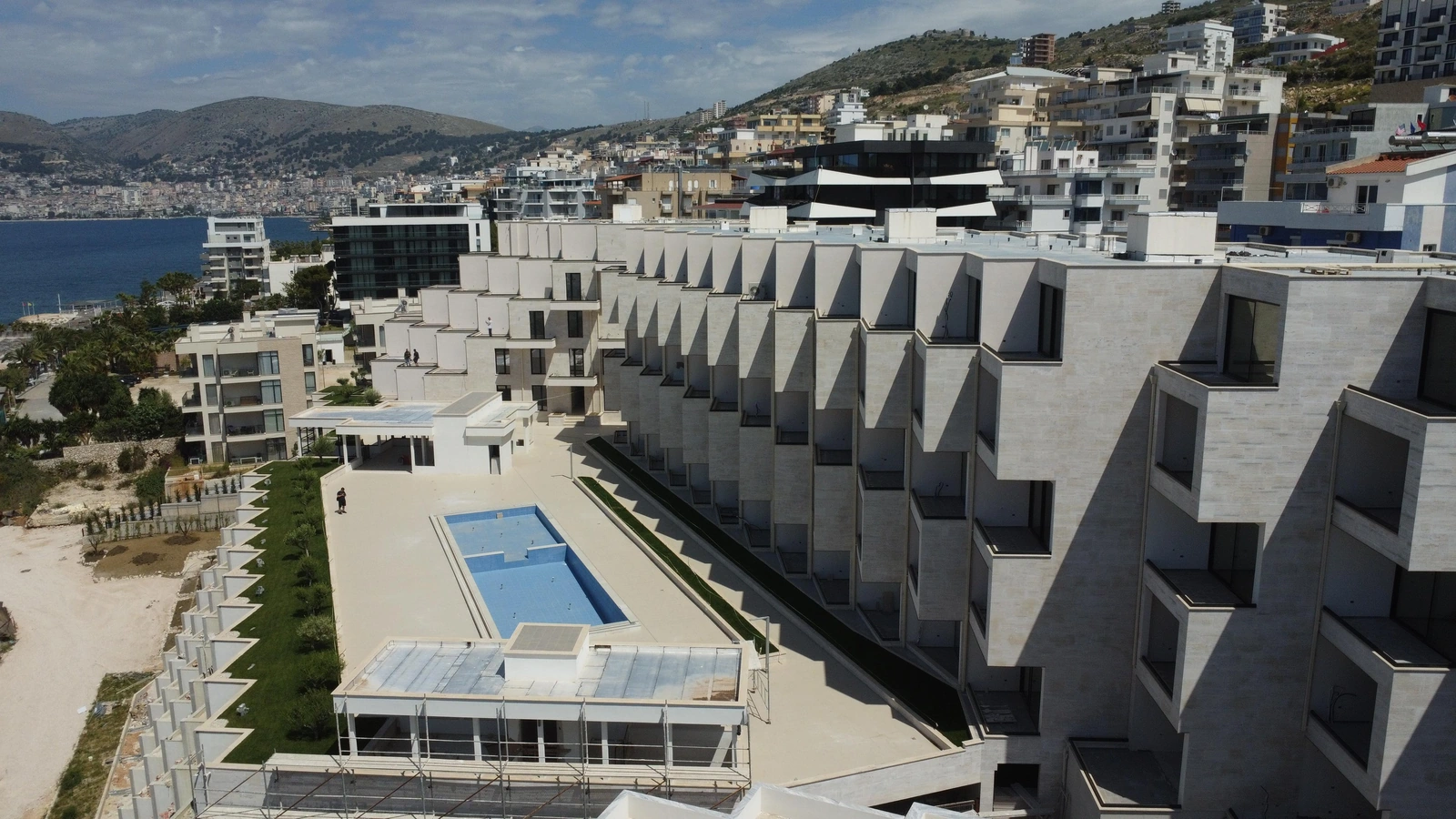 The terraces and pool within the Ionian Bay development